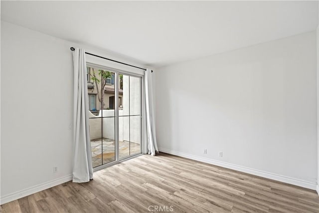 80 Hedge Bloom, Irvine, CA 92618 - empty room with wood finished floors and baseboards