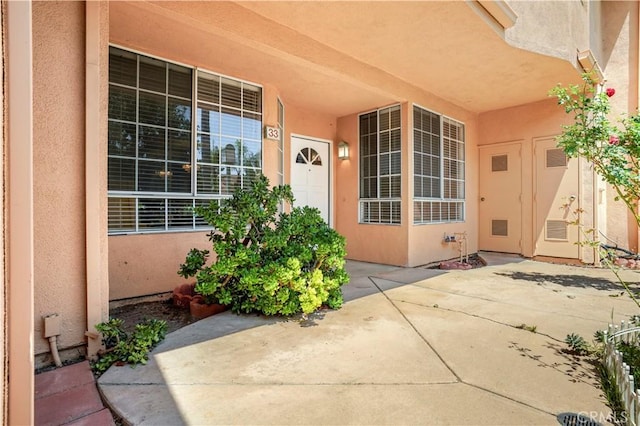 33 Abrazo Aisle Unit 174, Irvine, CA 92614 - entrance to property featuring stucco siding