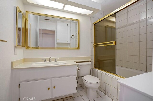 33 Abrazo Aisle Unit 174, Irvine, CA 92614 - bathroom with vanity, tile patterned floors, and tiled shower / bath