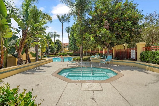 33 Abrazo Aisle Unit 174, Irvine, CA 92614 - community pool featuring a hot tub and a patio area