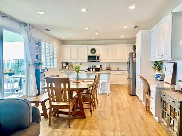 281 Singleton Canyon Rd, Calimesa, CA 92320 - kitchen featuring stainless steel appliances, white cabinets, light wood-style floors, and recessed lighting