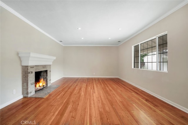 17450 Devonshire St, Northridge, CA 91325 - unfurnished living room with a warm lit fireplace, light wood-style floors, ornamental molding, and recessed lighting