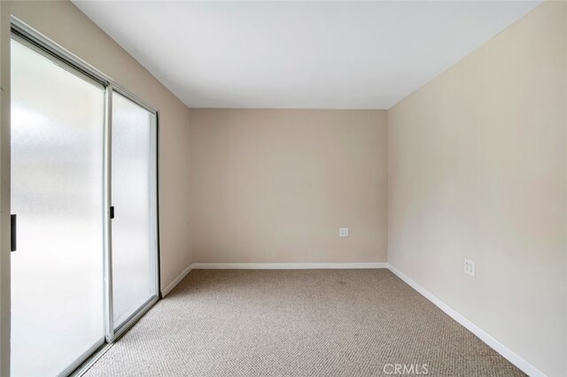 17450 Devonshire St, Northridge, CA 91325 - unfurnished bedroom featuring light carpet and baseboards