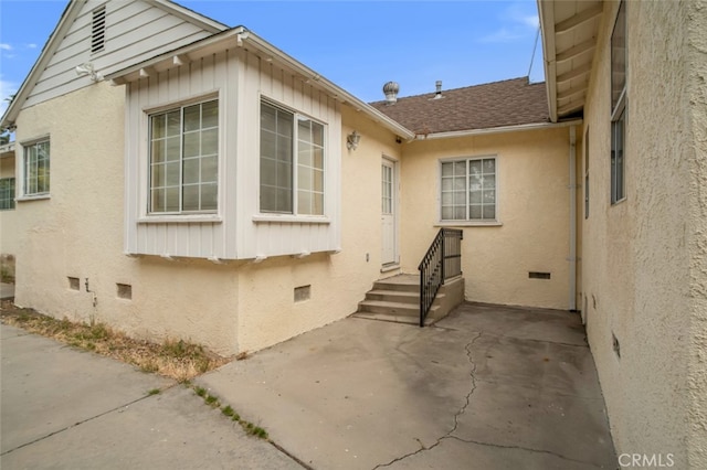 17450 Devonshire St, Northridge, CA 91325 - entrance to property featuring crawl space, a patio, a shingled roof, and stucco siding