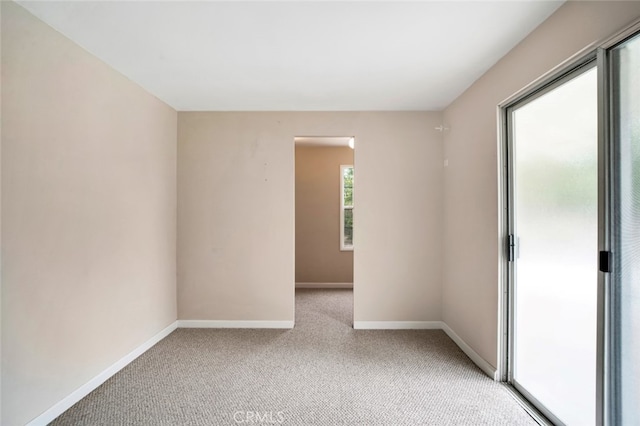 17450 Devonshire St, Northridge, CA 91325 - empty room featuring light carpet and baseboards