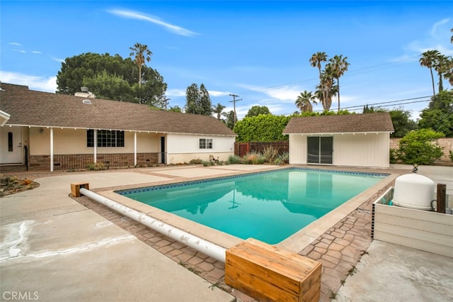 17450 Devonshire St, Northridge, CA 91325 - view of swimming pool with an outbuilding and a patio area