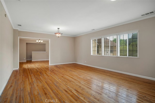 17450 Devonshire St, Northridge, CA 91325 - unfurnished room featuring a chandelier, ornamental molding, and light wood-style floors