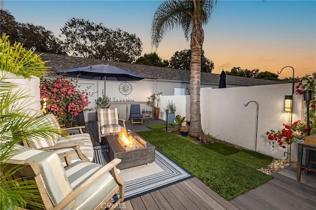 16520 Harbour Ln Unit 6, Huntington Beach, CA 92649 - view of yard with a fire pit and a wooden deck
