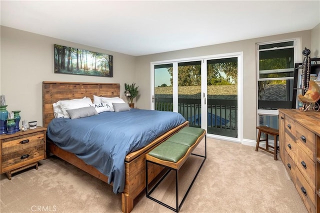 16520 Harbour Ln Unit 6, Huntington Beach, CA 92649 - bedroom with access to exterior and light carpet
