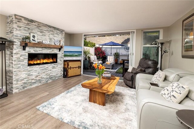 16520 Harbour Ln Unit 6, Huntington Beach, CA 92649 - living area featuring a fireplace and wood finished floors