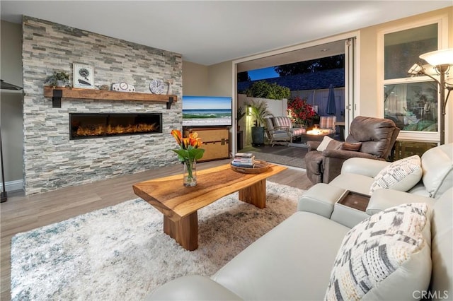 16520 Harbour Ln Unit 6, Huntington Beach, CA 92649 - living area featuring wood finished floors and a fireplace
