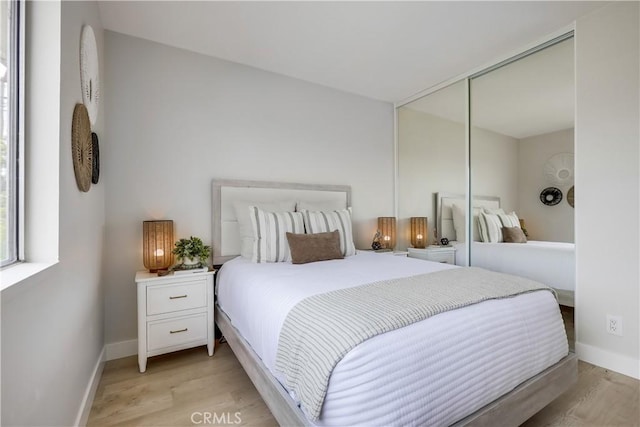 22701 Via Castilla, Lake Forest, CA 92630 - bedroom featuring light wood-style flooring and a closet