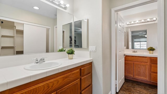 534 64th St, San Diego, CA 92114 - bathroom with vanity, a ceiling fan, and a closet