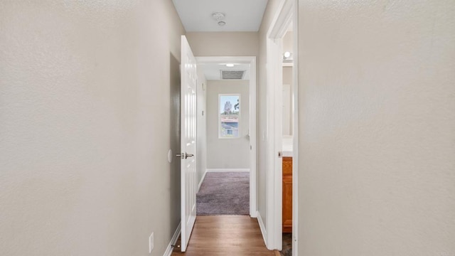 534 64th St, San Diego, CA 92114 - corridor featuring baseboards and wood finished floors