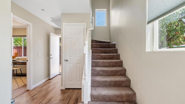 534 64th St, San Diego, CA 92114 - stairway featuring wood finished floors