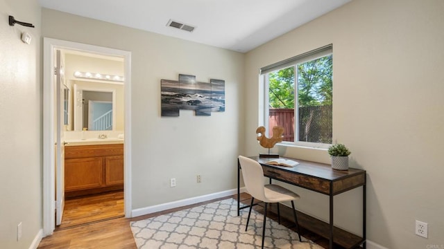534 64th St, San Diego, CA 92114 - home office with light wood finished floors and baseboards