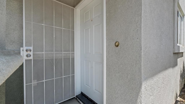 534 64th St, San Diego, CA 92114 - doorway to property featuring stucco siding