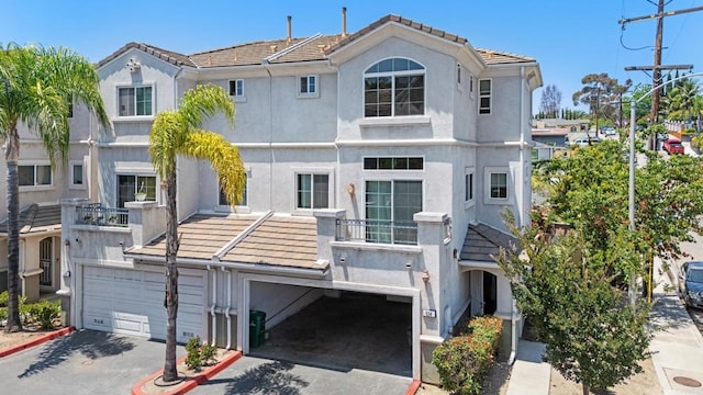 534 64th St, San Diego, CA 92114 - view of front facade with a garage, driveway, a tiled roof, and stucco siding