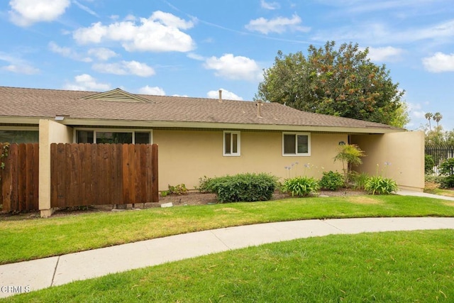 2247 Camilar Dr, Camarillo, CA 93010 - view of home's exterior featuring stucco siding and roof with shingles
