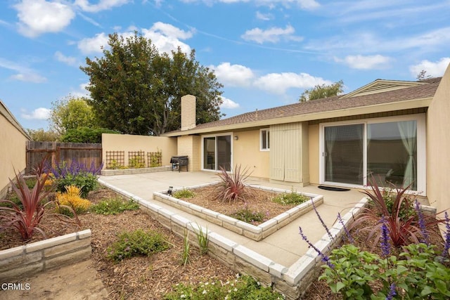 2247 Camilar Dr, Camarillo, CA 93010 - rear view of house with a patio area, a chimney, and roof with shingles