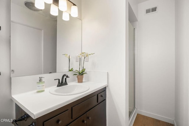 2247 Camilar Dr, Camarillo, CA 93010 - bathroom with vanity, a stall shower, and wood finished floors