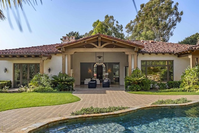 17324 Calle Serena, Rancho Santa Fe, CA 92067 - back of property featuring a tiled roof, a yard, and stucco siding