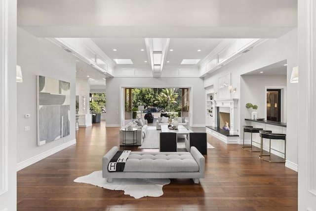 17324 Calle Serena, Rancho Santa Fe, CA 92067 - living area featuring hardwood / wood-style flooring, a warm lit fireplace, ornamental molding, and recessed lighting