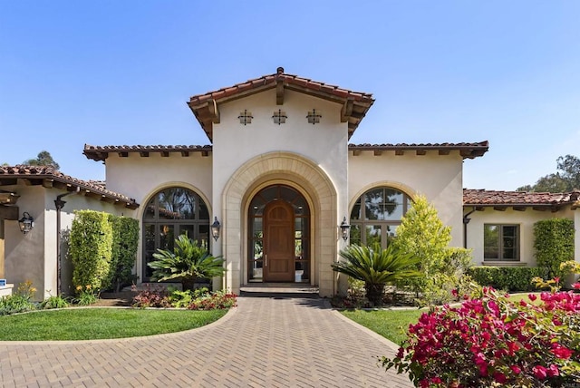 17324 Calle Serena, Rancho Santa Fe, CA 92067 - doorway to property featuring stucco siding and a tiled roof