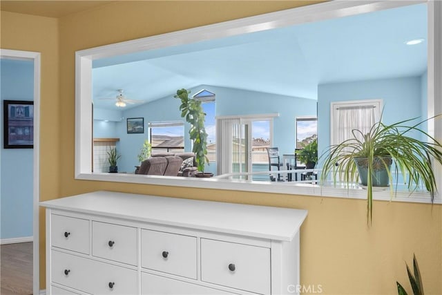 1358 Clarabelle Dr, Morro Bay, CA 93442 - kitchen with ceiling fan, vaulted ceiling, wood finished floors, white cabinetry, and light countertops
