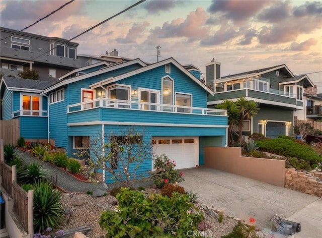 1358 Clarabelle Dr, Morro Bay, CA 93442 - view of front of home with a balcony, concrete driveway, and an attached garage