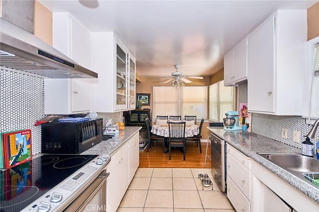 900 S Los Robles Ave, Pasadena, CA 91106 - kitchen featuring wall chimney exhaust hood, black microwave, white cabinetry, and tasteful backsplash