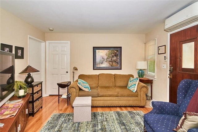 900 S Los Robles Ave, Pasadena, CA 91106 - living room featuring a wall unit AC and light wood-style flooring