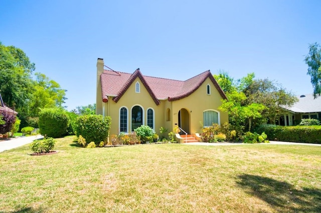900 S Los Robles Ave, Pasadena, CA 91106 - mediterranean / spanish home featuring a chimney, stucco siding, and a front yard