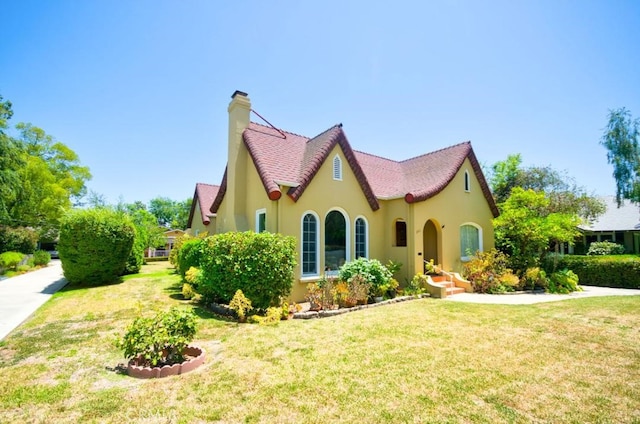 900 S Los Robles Ave, Pasadena, CA 91106 - view of front of home featuring a chimney, a front yard, and stucco siding