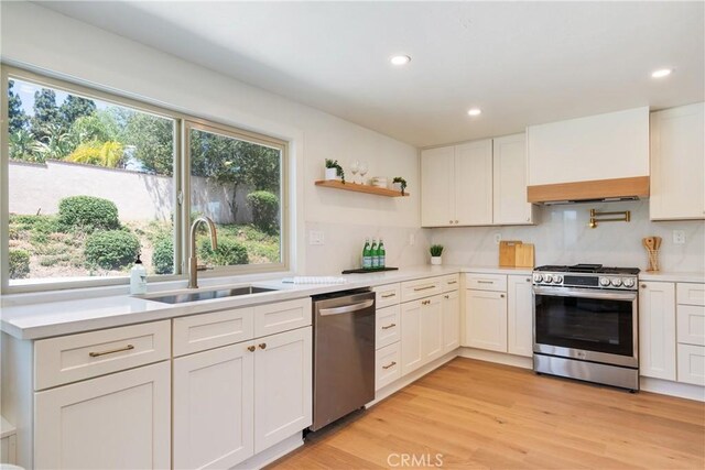 21679 Calle Alcazar, Yorba Linda, CA 92887 - kitchen featuring stainless steel appliances, custom exhaust hood, light countertops, recessed lighting, and light wood-style floors