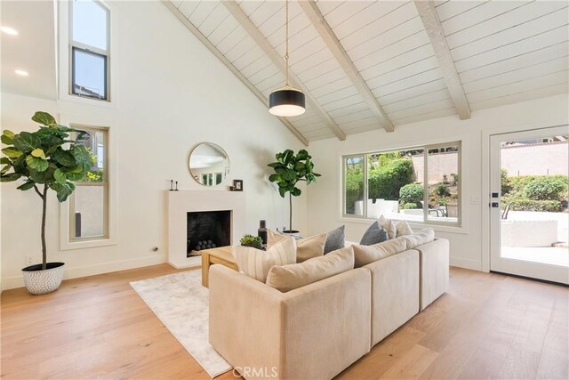 21679 Calle Alcazar, Yorba Linda, CA 92887 - living room featuring light wood-style floors, a fireplace with raised hearth, high vaulted ceiling, a wood ceiling with exposed beams, and recessed lighting