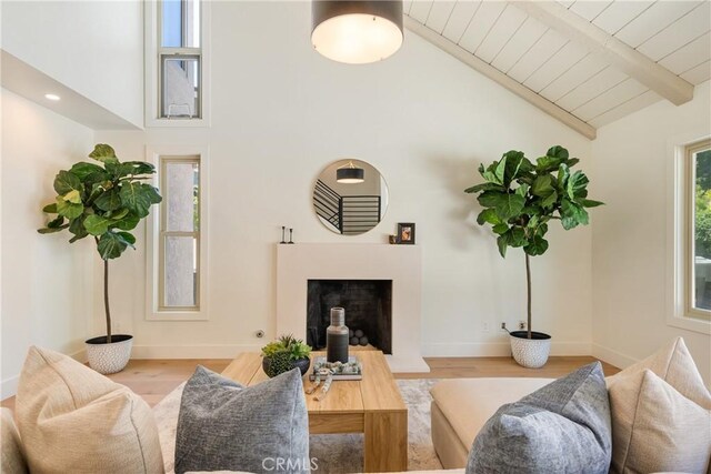 21679 Calle Alcazar, Yorba Linda, CA 92887 - living room featuring wood finished floors, a wood ceiling with exposed beams, a fireplace, and high vaulted ceiling