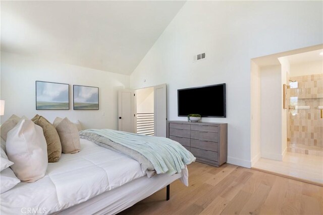 21679 Calle Alcazar, Yorba Linda, CA 92887 - bedroom featuring high vaulted ceiling, light wood-style flooring, and connected bathroom