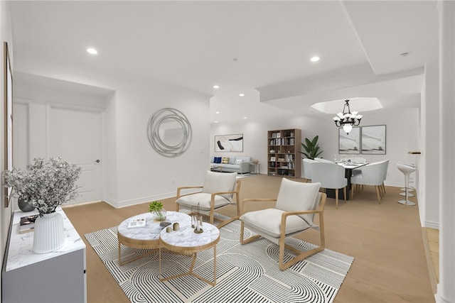 8555 Cashio St Unit 203, Los Angeles, CA 90035 - living room with a chandelier, light wood-type flooring, and recessed lighting