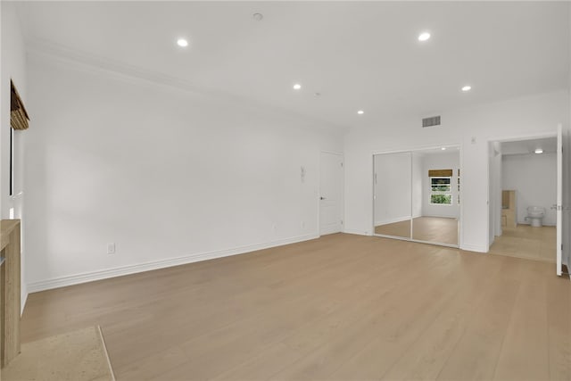 8555 Cashio St Unit 203, Los Angeles, CA 90035 - unfurnished living room with recessed lighting and light wood-type flooring