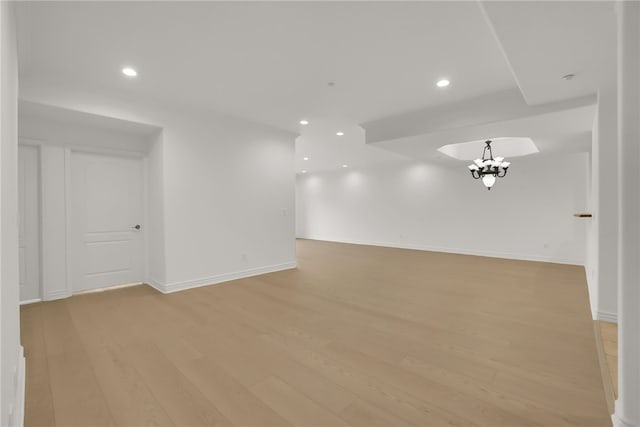 8555 Cashio St Unit 203, Los Angeles, CA 90035 - unfurnished room with light wood finished floors, a chandelier, and recessed lighting