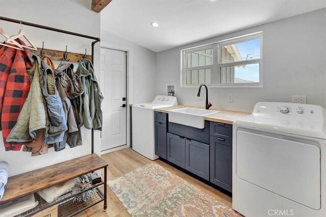 1500 Pacific Ave, Norco, CA 92860 - laundry room featuring cabinet space, light wood-style floors, washing machine and clothes dryer, and recessed lighting