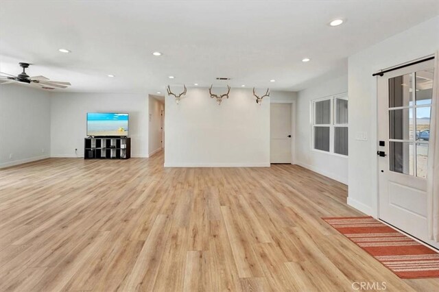1500 Pacific Ave, Norco, CA 92860 - unfurnished living room featuring recessed lighting, light wood-style flooring, and a ceiling fan