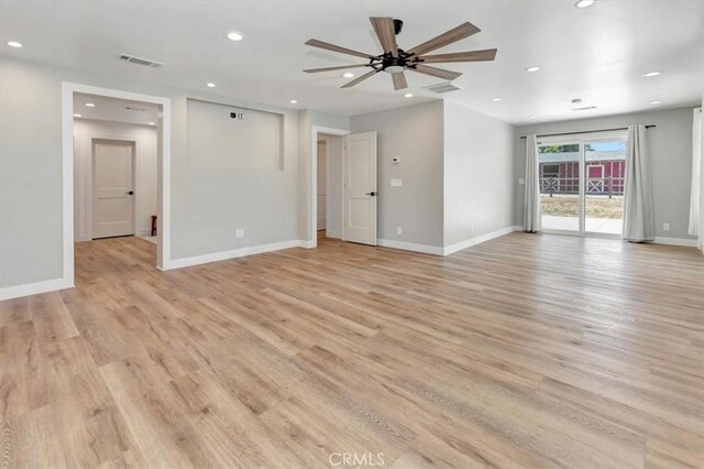 1500 Pacific Ave, Norco, CA 92860 - unfurnished living room with light wood-type flooring, ceiling fan, and recessed lighting