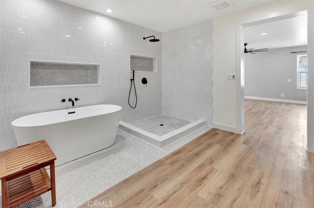 1500 Pacific Ave, Norco, CA 92860 - bathroom featuring wood finished floors, tiled shower, a soaking tub, a ceiling fan, and recessed lighting