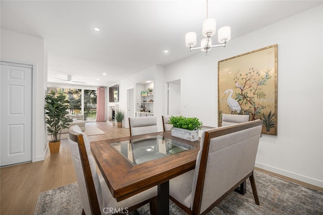1520 Camden Ave Unit 101, Los Angeles, CA 90025 - dining room with a chandelier, wood finished floors, and recessed lighting