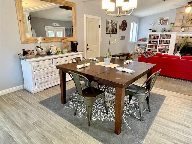 3332 Shamrock Pl, Merced, CA 95340 - dining room with light wood-type flooring and a chandelier