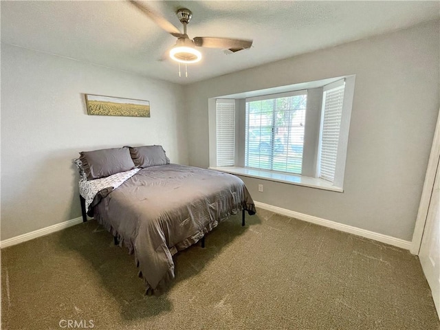 3332 Shamrock Pl, Merced, CA 95340 - carpeted bedroom with baseboards and a ceiling fan