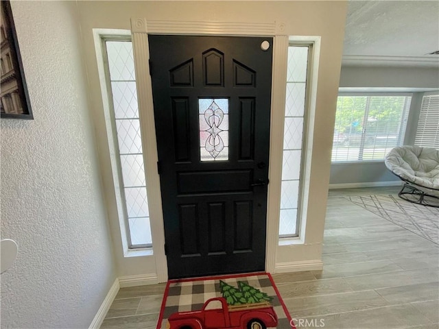 3332 Shamrock Pl, Merced, CA 95340 - foyer with a textured wall and light wood-type flooring