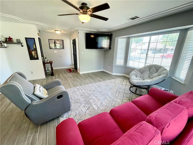 3332 Shamrock Pl, Merced, CA 95340 - living area with healthy amount of natural light, wood finished floors, and a ceiling fan